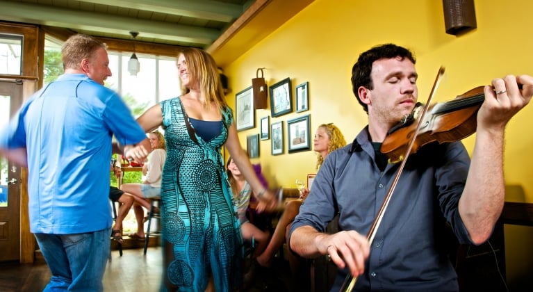 A couple dances at the Red Shoe Pub in Mabou as the fiddle plays on