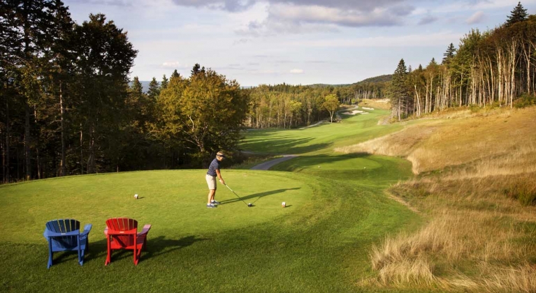 golfer gets ready to take a swing on cape breton island